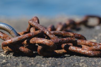 Closeup of a piled up rusty chain